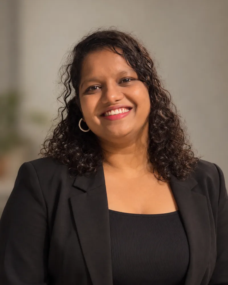 Krutika Palav, founder of KrixelX Digital Solutions, smiling in a black blazer