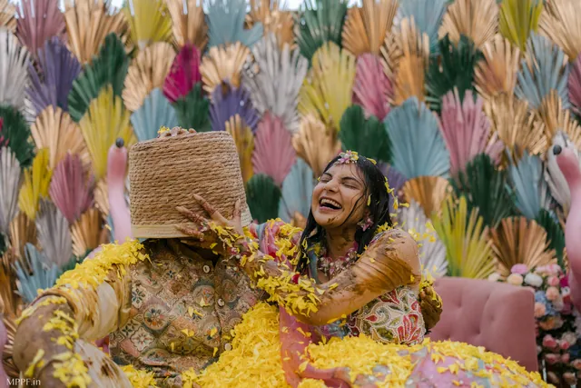 Bride laughing at her haldi